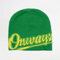 Green beanie with yellow text on a light gray background