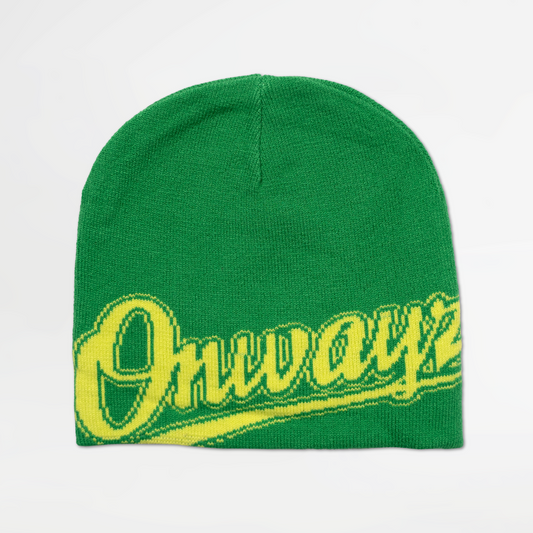 Green beanie with yellow text on a light gray background